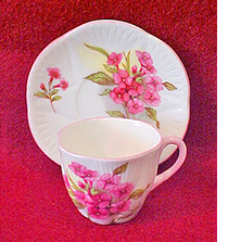 Dainty miniature cup and saucer 'Stocks' pattern